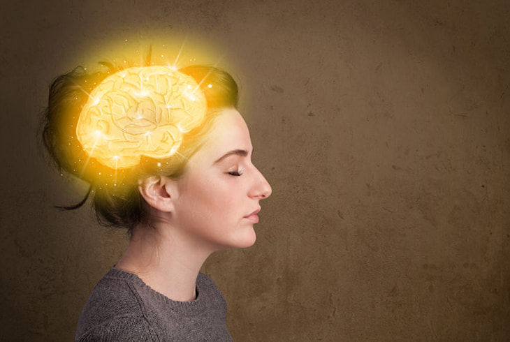 Woman with illuminated brain